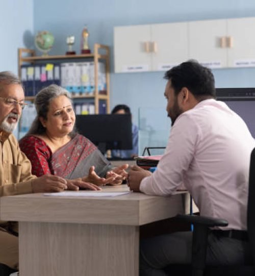 senior couple meeting with financial advisor